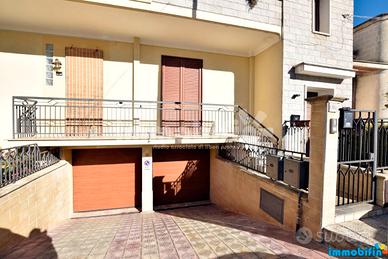 Appartamento piano rialzato con cortile e garage