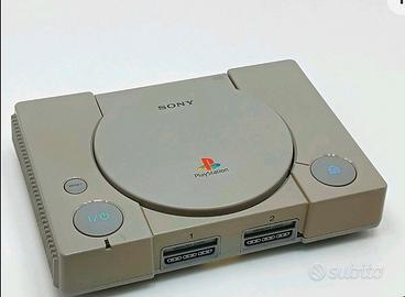 playstation 1 con giochi e 2 controller
