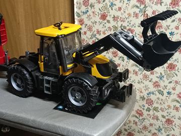 trattore forestale Bruder con attrezzi 