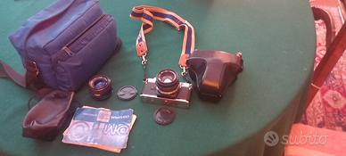 Apparecchio fotografico Olimpus OM 10 + obbiettivo