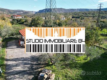 DOMIO: Terreno edificabile con ampio magazzino/dep