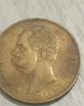 Moneta 100 lire d'oro 1883 leggi il testo