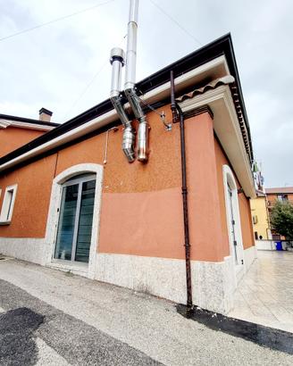 Locale commerciale con forno e canna fumaria