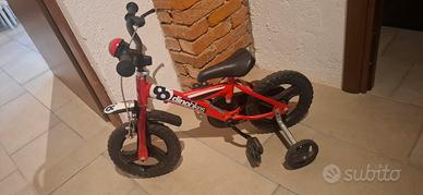 Bicicletta bambino Dinobikes rossa con rotelle