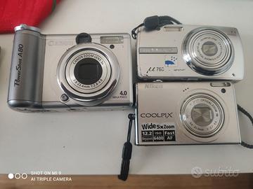 Tre macchine fotografiche digitali Canon Olympus N