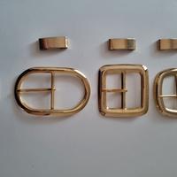 Lotto 4 fibbie per cintura in metallo color oro