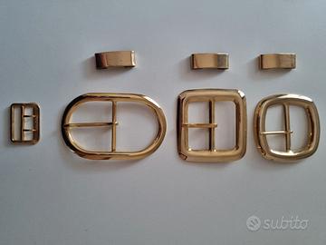Lotto 4 fibbie per cintura in metallo color oro