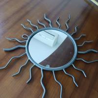 Specchio a forma di sole in ferro battuto