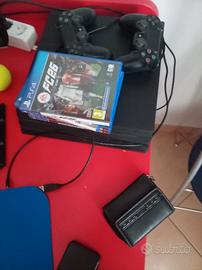 ps4 usata + 2 controller + 4 giochi( fc 26 ecc....