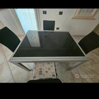 tavolo in vetro con sedie 