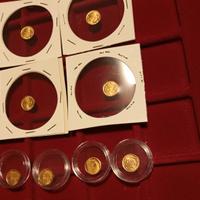 Lotto 12 monetine oro 8 K. Mussolini 20 lire , e c