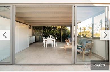 Elegante casa con veranda e giardino privato