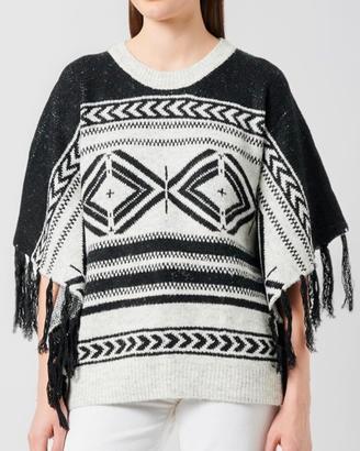 Poncho con fantasia etnica