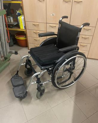 Carrozzina pieghevole PROGEO con cuscino