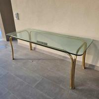 Tavolo in vetro con gambe tubolari