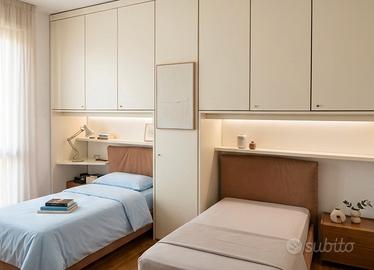 2 letti singoli con reti e materassi e copertura