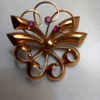 spilla e anello e orologio da tasca