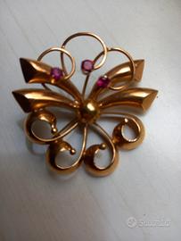 spilla e anello e orologio da tasca