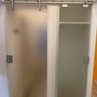 Porta doppia scorrevole esterna a muro