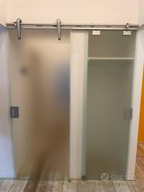 Porta doppia scorrevole esterna a muro