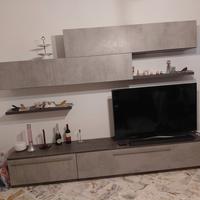 parete attrezzata e letto piazza e mezza