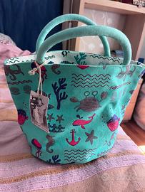 Pochette reversibile con pareo in pendant