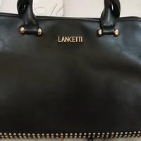 Borsa nero in ecopelle con borchie