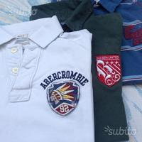 Magliette polo ragazzo stock