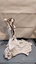 Scultura  Giuseppe Armani " Fanciula seduta con vi