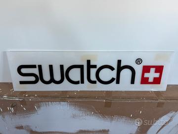 Insegna originale SWATCH®