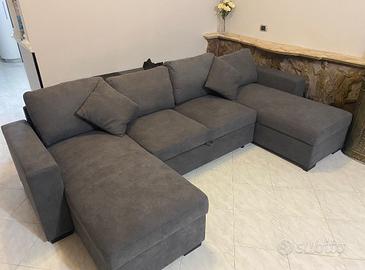 Divano angolare apribile con contenitore.