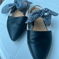 Scarpa sabot aperta in pelle nera e fiocco