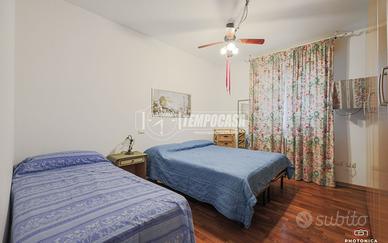 APPARTAMENTO CON GIARDINO E POSTO AUTO