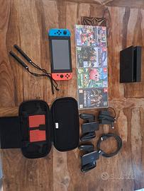 nintendo switch + 4 giochi+ custodia 