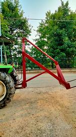 Caricatore rotoballe