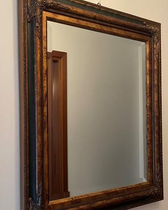 Specchio rettangolare con cornice decorata