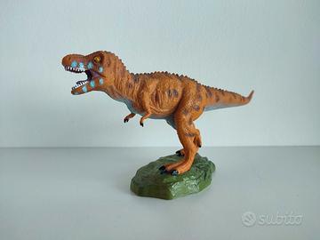 Dinosauro con piedistallo