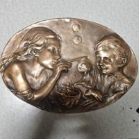 placca bronzo donna bambino bolle