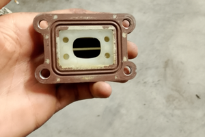 Pacco lamellare e collettore d'aspirazione