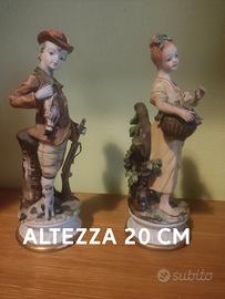 due statue di Capodimonte lui cacciatore lei vende