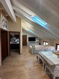 Trilocale mansardato arredato