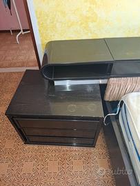 letto anni 70 - in legno nero. con testata e comod