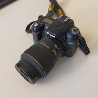 fotocamera + obiettivo macro