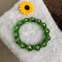 Bracciale perle verdi con evil eye portafortuna