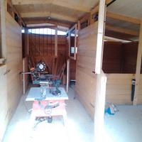 Box per cavalli con corridoio centrale