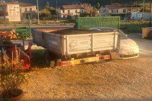 Trasporto cingolato più rimorchio tritatele