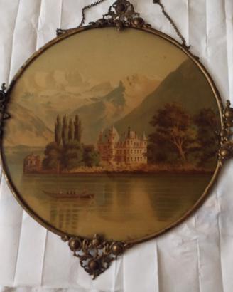 Cornice circolare con castello e lago romantico