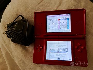 Nintendo DS Lite  + Custodia Hello Kitty + Giochi