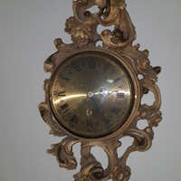 Orologio da muro scolpito