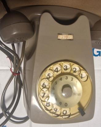 Telefono sip a disco grigio da muro